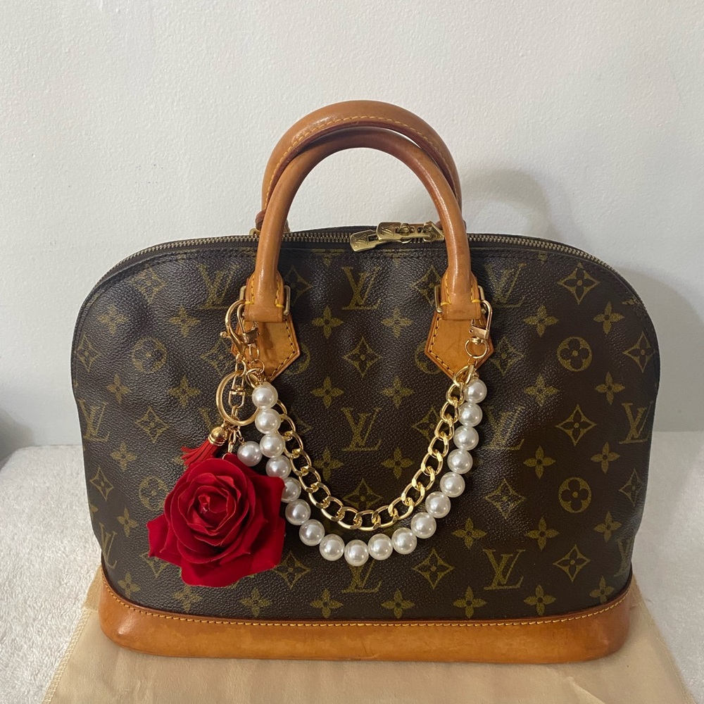 #40. Auth Louis Vuitton Alma Handbag